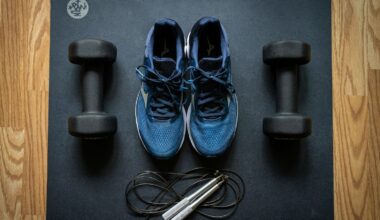 Sneakers, weights, on a gym mat