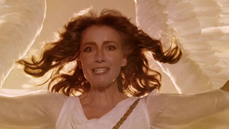 The Angel America (Emma Thompson) stands in divine light on Angels in America