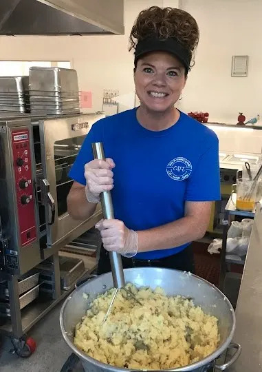 Stephanie Mickles, school nutrition manager, preparing yukon gold potato smash. Courtesy of Yadkin County Schools