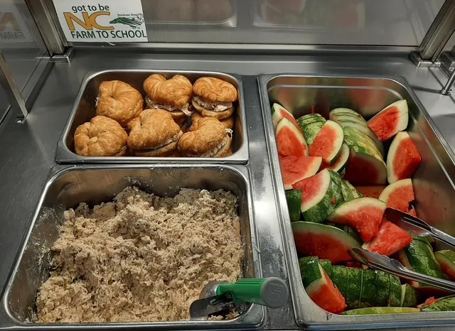 Scratch-made chicken salad on a croissant served with fresh N.C. watermelon. Courtesy of Yadkin County Schools
