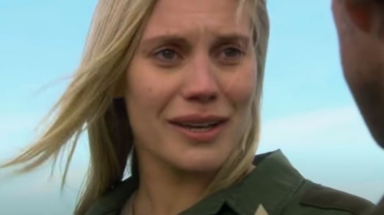 Katee Sackhoff as Starbuck standing outside in Battlestar Galactica