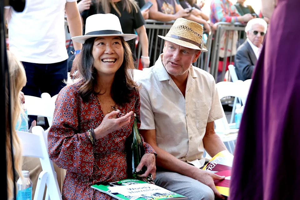 HOLLYWOOD, CALIFORNIA - DECEMBER 11: (L-R) Laura Louie and Woody Harrelson attend the Star Ceremony honoring James L. Brooks on The Hollywood Walk of Fame attends on December 11, 2025 in Hollywood, California.  (Photo by Kevin Winter/Getty Images)