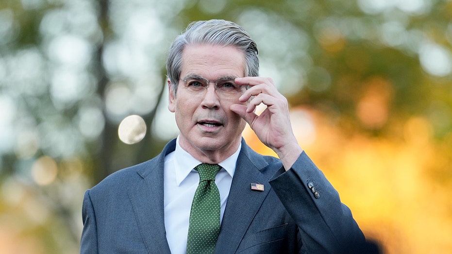 Bessent adjusts his glasses at WH gaggle