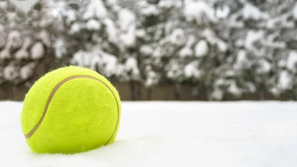  Tennis ball on snow. 