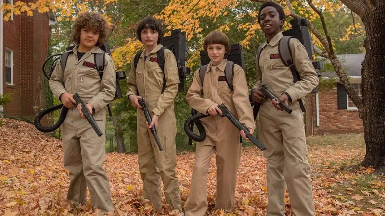 Gaten Matarazzo's Dustin, Finn Wolfhard's Mike, Noah Schnapp's Will and Caleb Mclaughlin's Lucas Sinclair dress as Ghostbusters for Halloween on Stranger Things.
