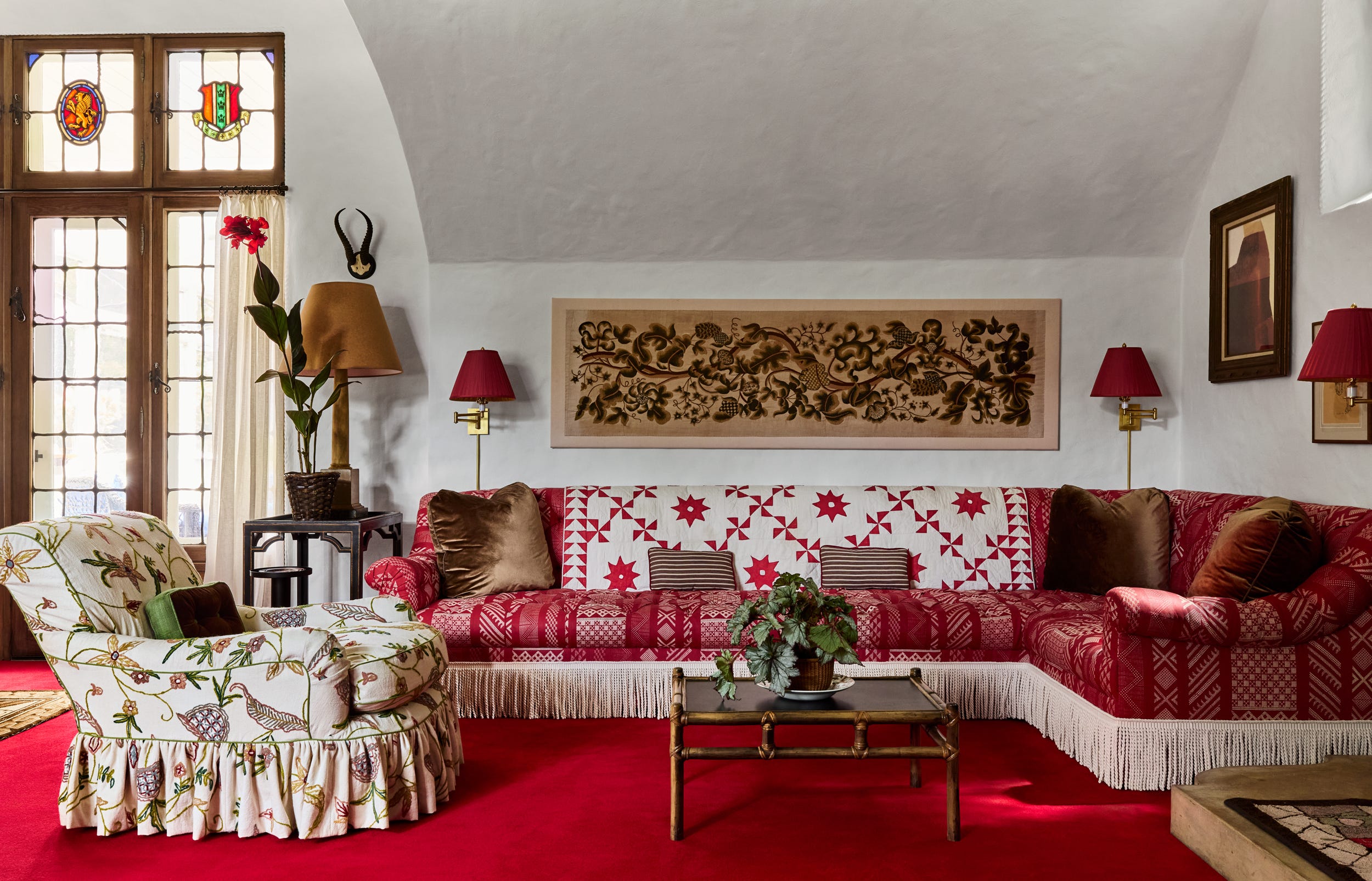 Cozy living room with patterned furniture and decorative elements.