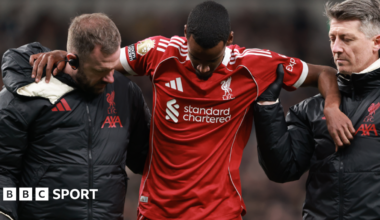 Alexander Isak is helped off the pitch after being injured while scoring for Liverpool in the Premier League win at Tottenham