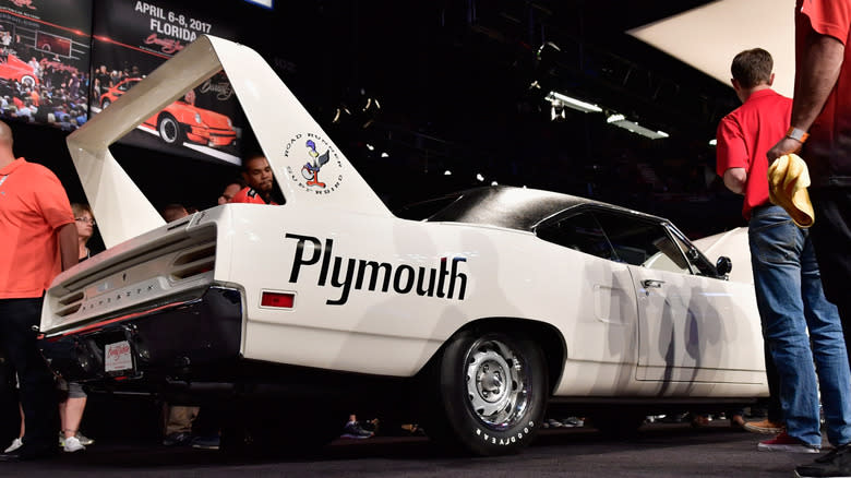 A white Plymouth Superbird is auctioned