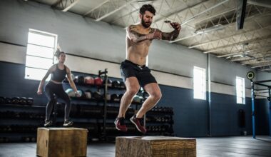 Plyometric exercise box jump being performed by a man and woman