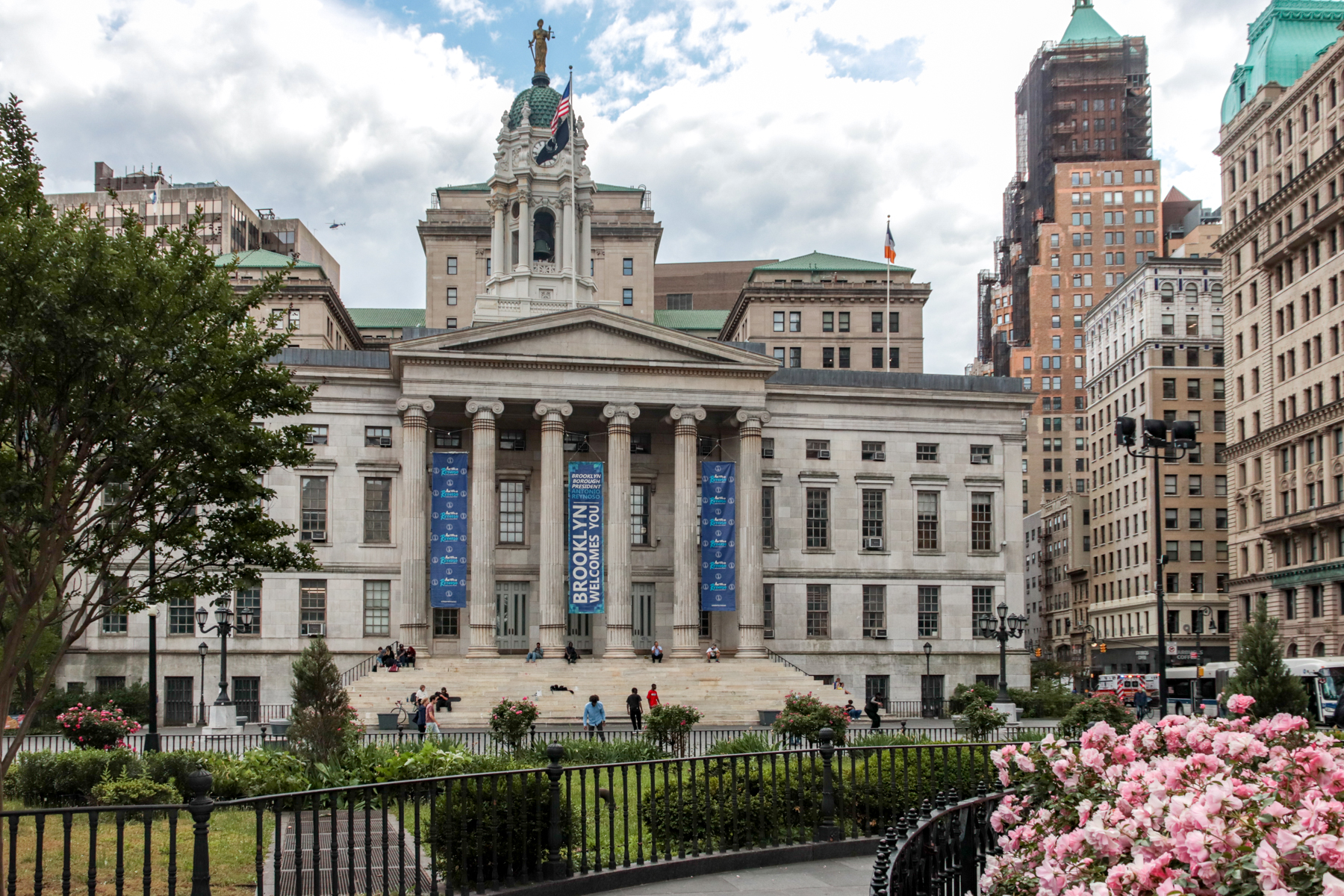 brooklyn borough hall with roses blooming in the foreground