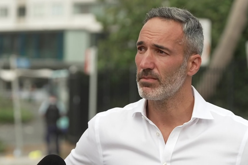 A man in a white shirt.