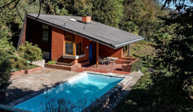 enrico sassi revisits 1970s lake house in switzerland