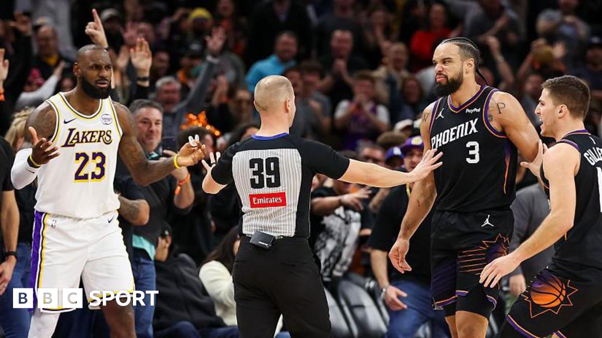 An official comes between Lebron James and Dillon Brooks