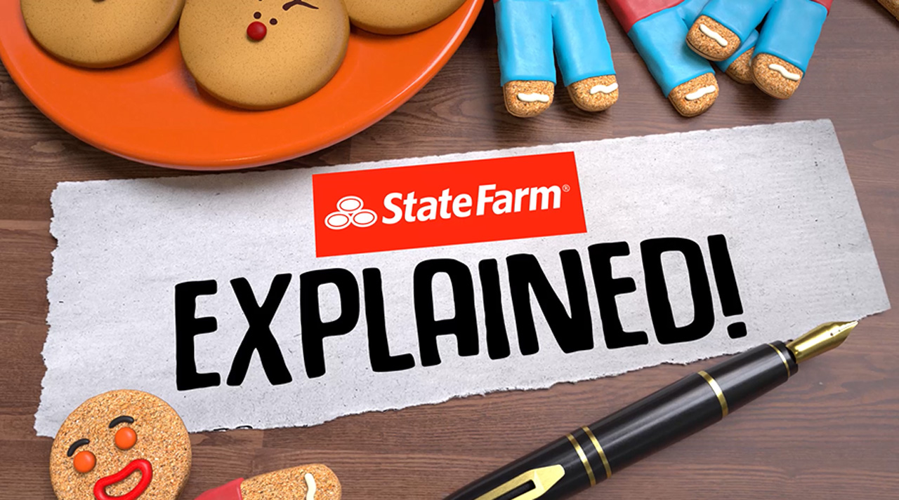 Table set with holiday and cookies and gingerbread men and the State Farm logo