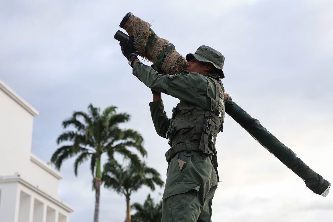A member of the Bolivarian National Armed Forces (FANB) holds an