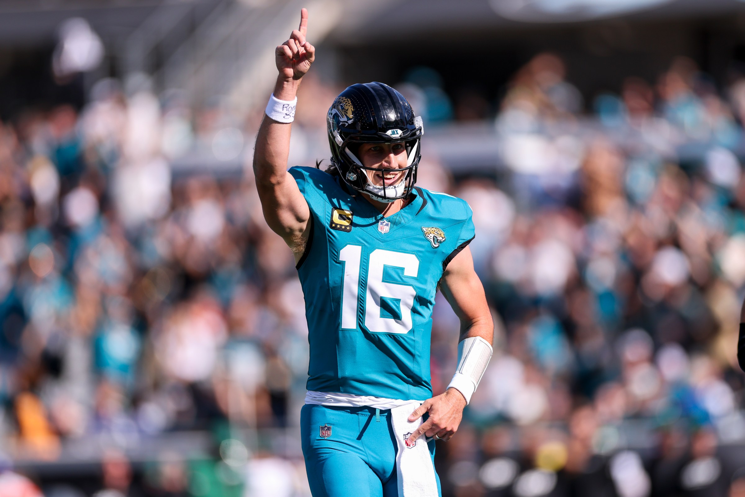 JACKSONVILLE, FLORIDA - DECEMBER 14: Trevor Lawrence #16 of the Jacksonville Jaguars celebrates a touchdown in the first quarter of an NFL 2025 game against the New York Jets at Everbank Stadium on December 14, 2025 in Jacksonville, Florida. (Photo by Logan Bowles/Getty Images)