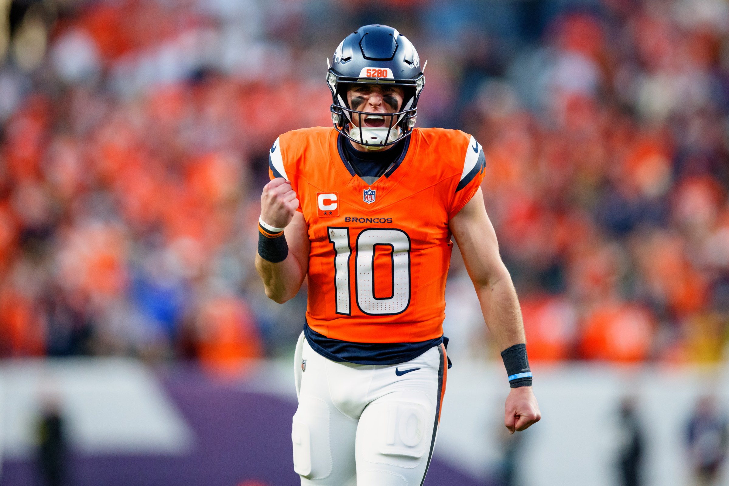 DENVER, CO - DECEMBER 14: Bo Nix #10 of the Denver Broncos celebrates after throwing a touchdown pass during the third quarter against the Green Bay Packers at Empower Field at Mile High on December 14, 2025 in Denver, Colorado. (Photo by Justin Edmonds/Getty Images)