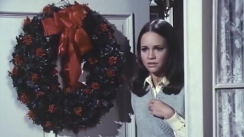 Sally Field as Christine, greeting a guest in Home for the Holidays