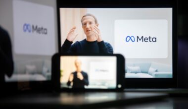 Mark Zuckerberg speaks during a virtual event announcing Facebook's rebranding as Meta, with the Meta logo visible on a screen behind him.
