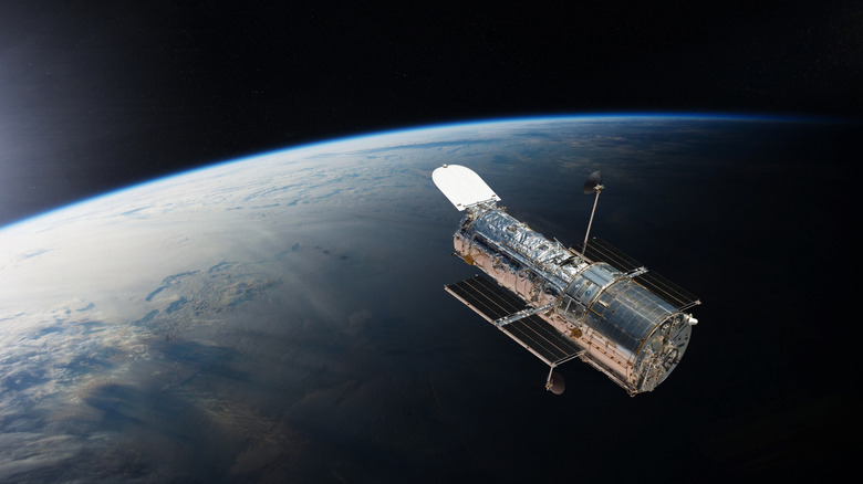 Hubble Space Telescope in the backdrop of earth