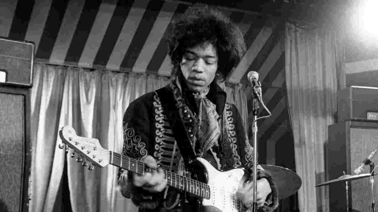 Jimi Hendrix performing onstage in 1967