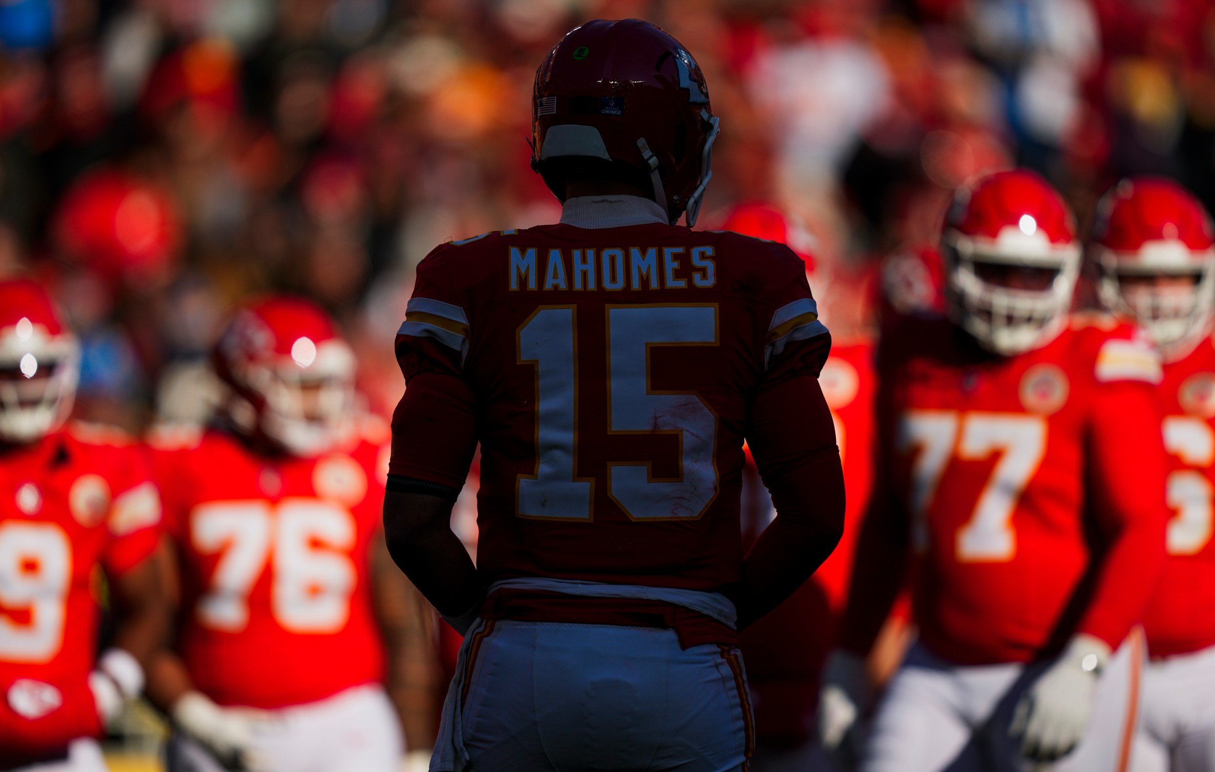 Dec 14, 2025; Kansas City, Missouri, USA; Kansas City Chiefs quarterback Patrick Mahomes (15) walks to the huddle from the sideline during the second quarter against the Los Angeles Chargers at GEHA Field at Arrowhead Stadium. Mandatory Credit: Jay Biggerstaff-Imagn Images