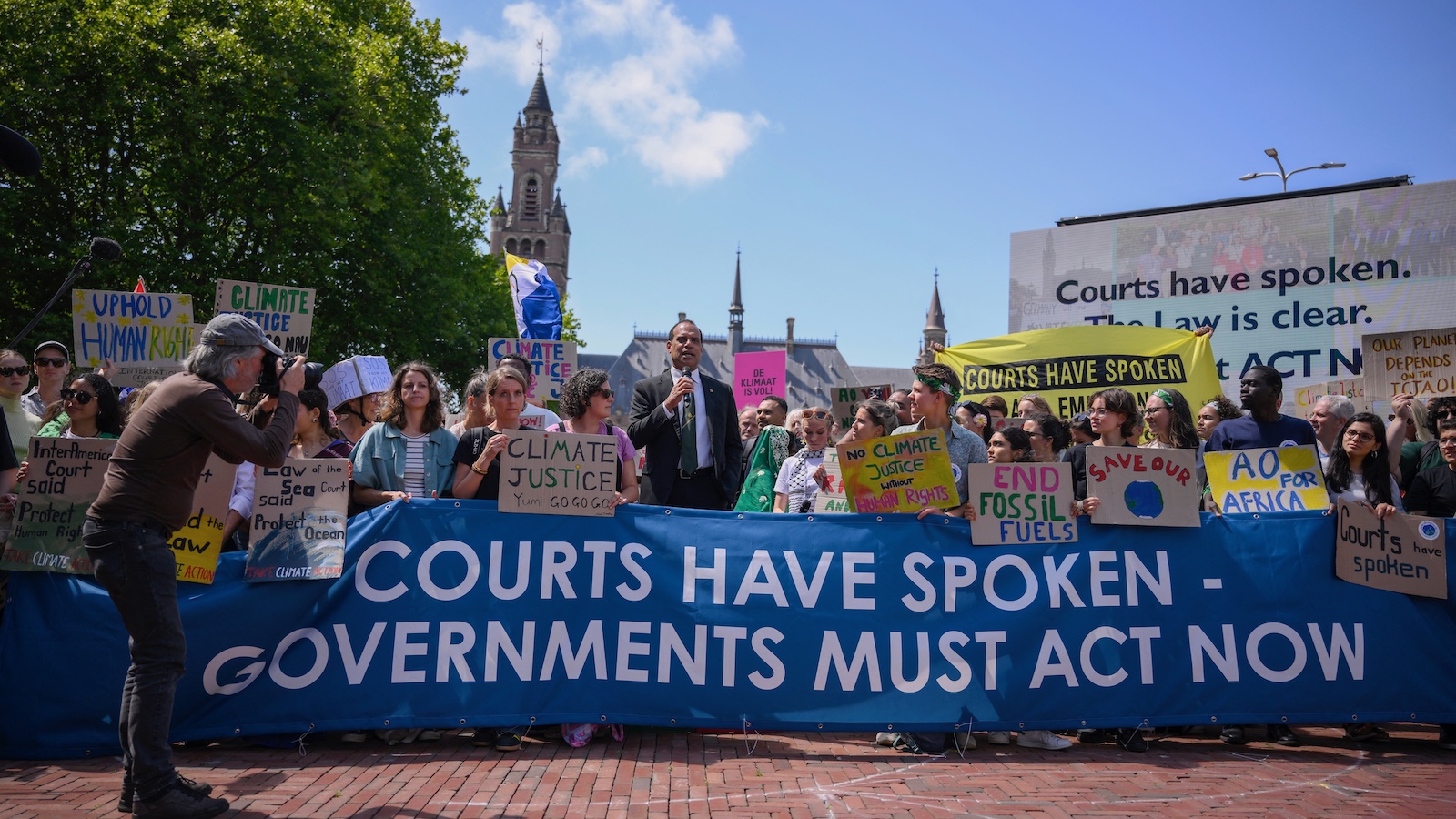 Ralph Regenvanu, the climate minister of the South Pacific nation of Vanuatu, delivers a speech as he attends a demonstration ahead of the International Court of Justice in The Hague.