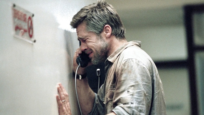 Richard crying while talking on a pay phone in Babel