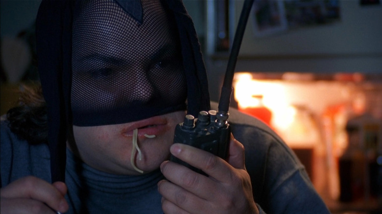 A masked J.D. McNugent eating spaghetti in Saving Silverman