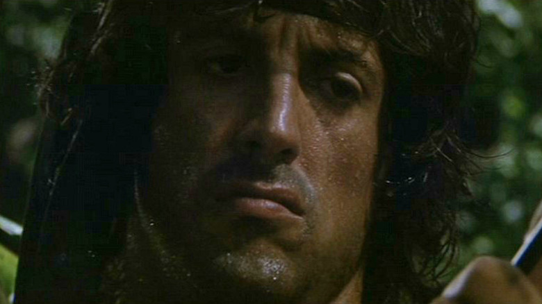 Sylvester Stallone's John Rambo stars at an arrow in Rambo: First Blood Part II