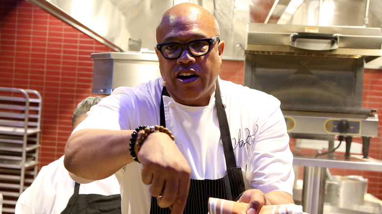 Jeff Henderson stirring during cooking demo