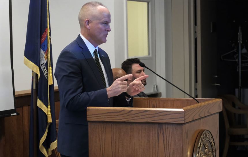 Judge Pierce F. Cohalan congratulates graduates of the Suffolk County veterans court at a ceremony in November.