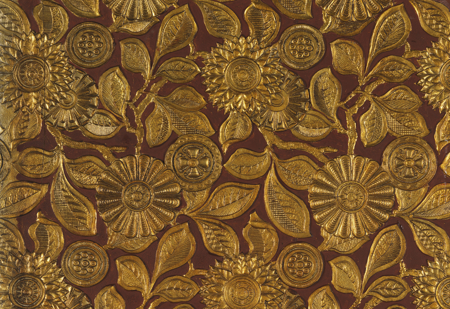 gold and burgundy painted lincrusta wall covering