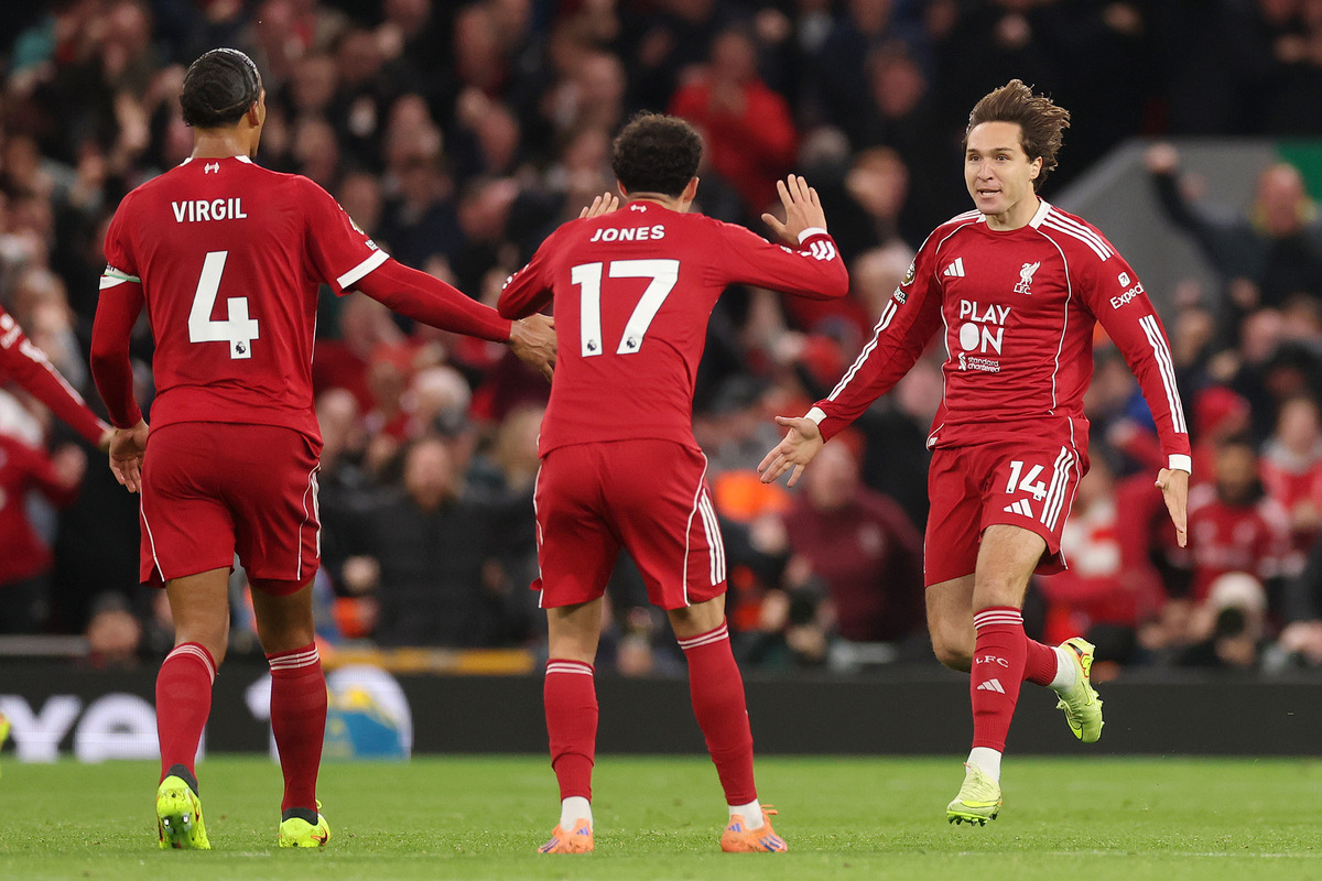 LIVERPOOL, ENGLAND - OCTOBER 19: Curtis Jones and Federico Chiesa of Liverpool celebrate after Cody Gakpo of Liverpool (not pictured) scores his team's first goal during the Premier League match between Liverpool and Manchester United at Anfield on October 19, 2025 in Liverpool, England. (Photo by Carl Recine/Getty Images)