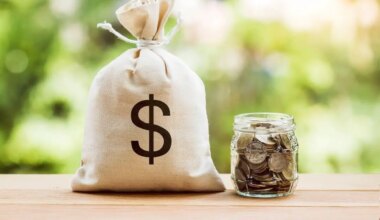 Bag of money next to a jar of coins