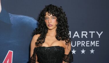 Odessa on the red carpet in a black dress.