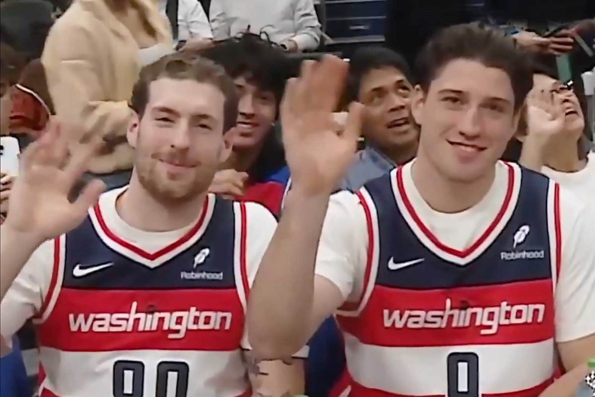 Ryan Leonard and Pierre-Luc Dubois, looking like a father and son, attend Washington Wizards game