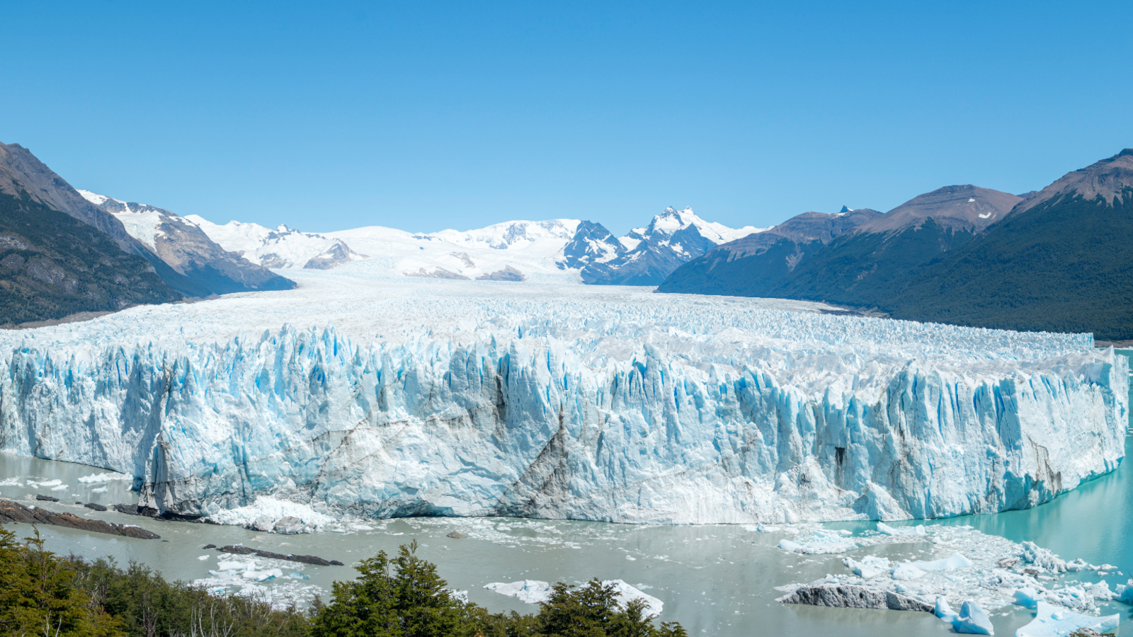 A photo of the exact point where the glacier, lake and river meet, taken from the nearby peninsula
