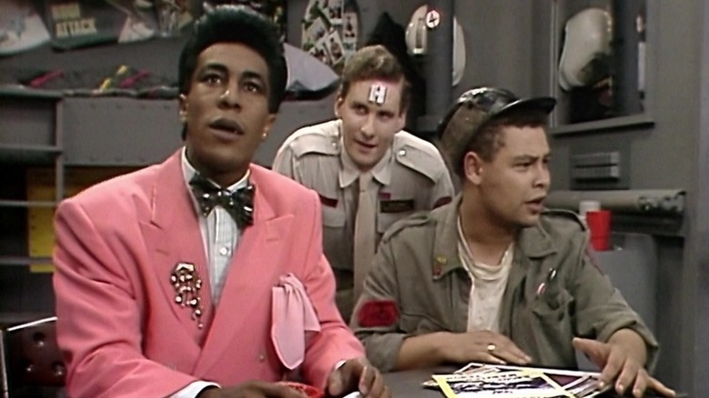 Danny John-Jules as Cat, Chris Barrie as Rimmer, and Craig Charles as Lister take stock of their situation in the pilot of Red Dwarf.