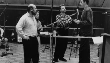 Rob Reiner watches as Harry Connick Jr. sings for the soundtrack to the movie "When Harry Met Sally," circa 1989. (Hulton Archive/Getty Images)