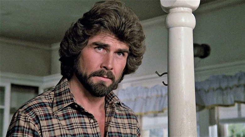 James Brolin as George Lutz standing in the bedroom in The Amityville Horror (1979)