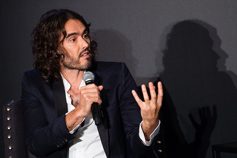 Russell Brand speaking at event