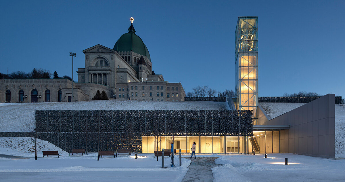 in montreal, saint joseph’s oratory pavilion glows behind gabion facades