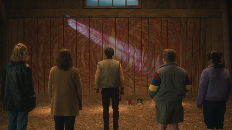Will and his friends stare at the mural in Stranger Things