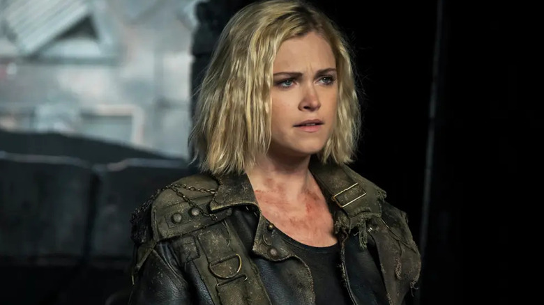 Clarke Griffin (Eliza Taylor) stands dirtied and bruised on The 100