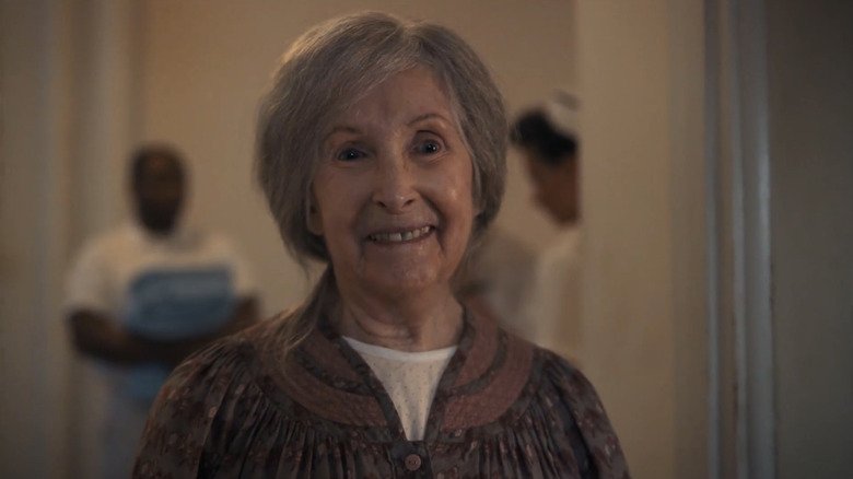 Joan Gregson's Ingrid Kirsh smiles as she stands in a doorway in It Welcome to Derry