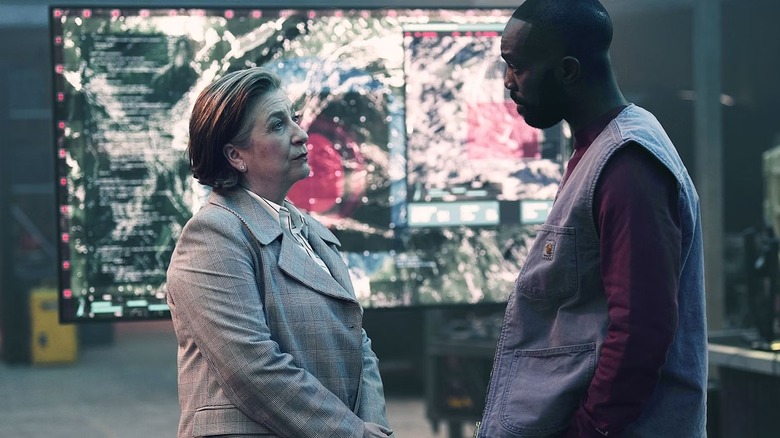 George (Paapa Essiedu) speaks with Elisabeth Wesley (Caroline Quentin) on The Lazarus Project