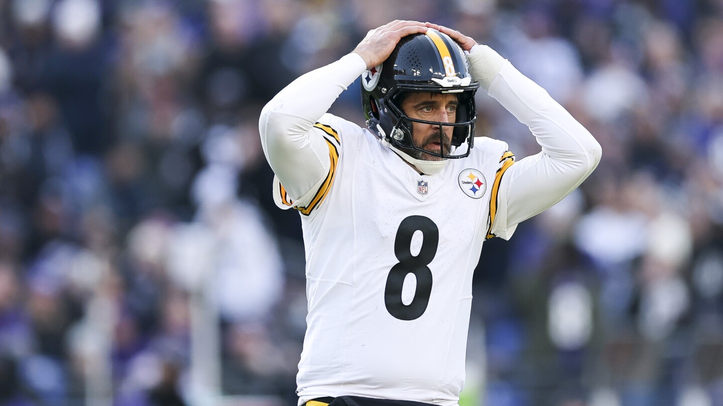 NFL says Aaron Rodgers completed the catch process, was down by contact