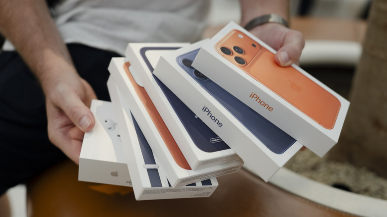 iPhone 17 models and accessories in retail boxes.