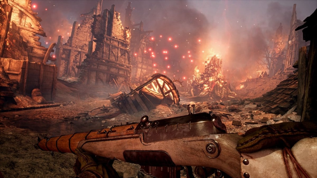 The player looks at a burning village in Witchfire